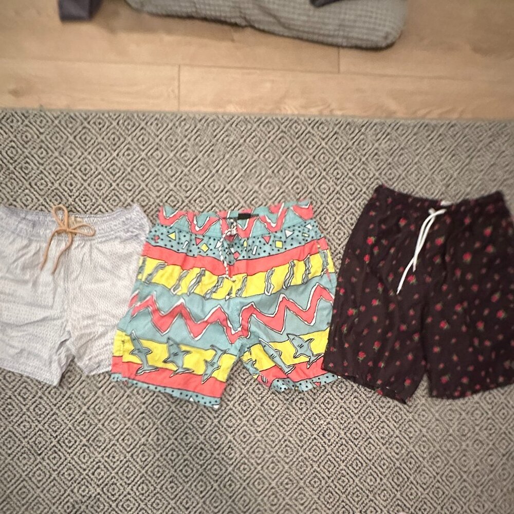 Three men's swim suits